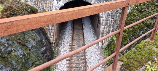 old railway tunnel going into mountain in norway