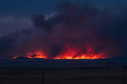 Wyoming wildfire landscape glowing fire at dusk night time guernsey forest fire HDR 