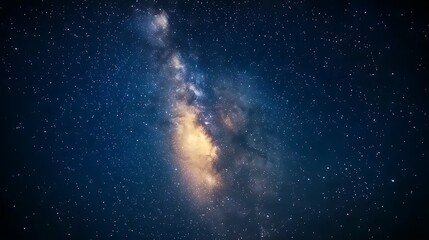 Fototapeta premium A clear night sky filled with stars, with the Milky Way visible in the background.