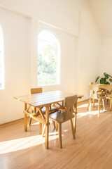 Modern interior of stylish dining room interior with family table and wood chairs,Neutral living room,stylish home decor,Template.
