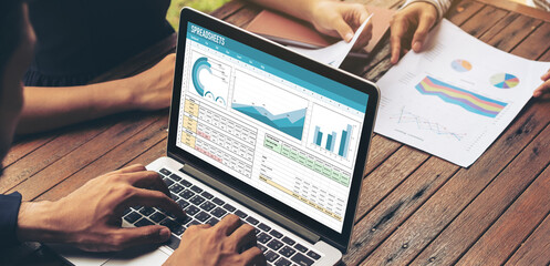 Spreadsheet document information financial startup concept. data and graphs in spreadsheet...
