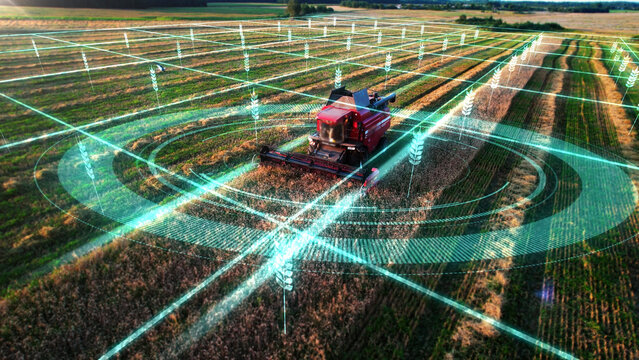 Autonomous self-driving combine harvester of the future with autopilot harvests grain field, scanning the environment with sensors. Smart farming, controlled by artificial intelligence.