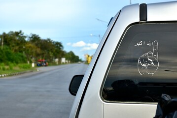 back of wite car with Allahu Akbar in Patani
