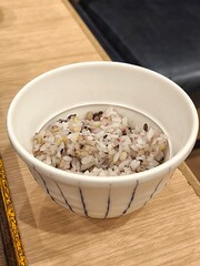 Cooked whole grain rice in ceramic bowl. Multigrain rice. Healthy food