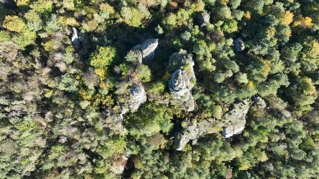 Aerial drone view of Zborow Hill, Poland. Limestone rock formation at peak of Gora Zborow, Podlesice, Poland. Krakow Czestochowa Upland. Polish Jurassic Highland Mountainl Zborow in autumn.