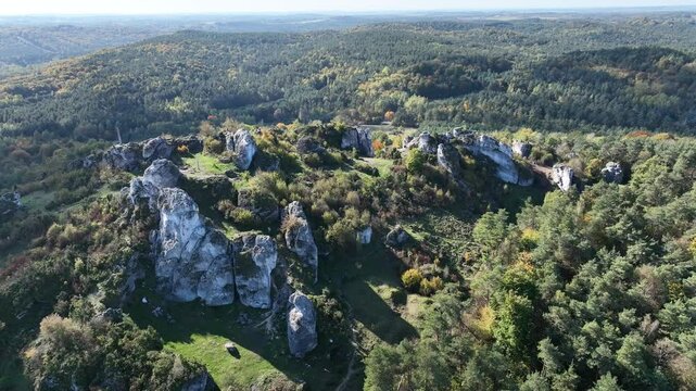 Aerial drone view of Zborow Hill, Poland. Limestone rock formation at peak of Gora Zborow, Podlesice, Poland. Krakow Czestochowa Upland. Polish Jurassic Highland Mountainl Zborow in autumn.