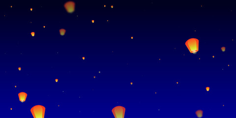 Sky lanterns floating in the night sky.