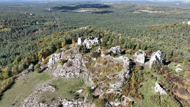 Aerial drone view of Zborow Hill, Poland. Limestone rock formation at peak of Gora Zborow, Podlesice, Poland. Krakow Czestochowa Upland. Polish Jurassic Highland Mountainl Zborow in autumn.