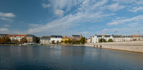 View across the lake to the different colored houses in COPENHAGEN. Incredible cityscape. This is a beautiful historical capital