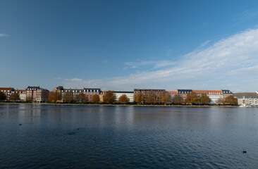 View across the lake to the different colored houses in COPENHAGEN. Incredible cityscape. This is a beautiful historical capital
