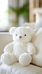 Fototapeta premium A soft white teddy bear sits on a white couch, its fluffy fur and sweet expression exuding warmth and comfort.