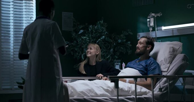 Mom, dad, and girl enjoying time in hospital. Nurse arrives, makes sure everything's fine.