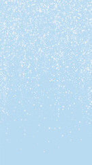 Magic falling snow christmas background. Subtle flying snow flakes and stars on light blue winter backdrop. Magic falling snow holiday scenery.   Vertical vector illustration.