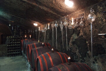 Old wood barrels in a rustic wine cellar
