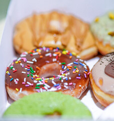 Assorted doughnuts in a box.