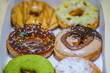 Assorted doughnuts in a box.
