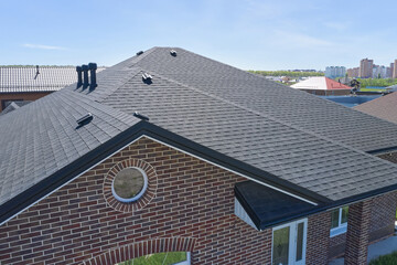 House roof with asphalt shingles
