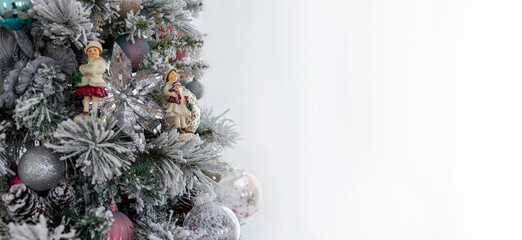 vintage christmas tree decorated in pastel shades with charming retro toys and ornaments, set against a minimalist background, allowing ample space for personalized festive text on the right