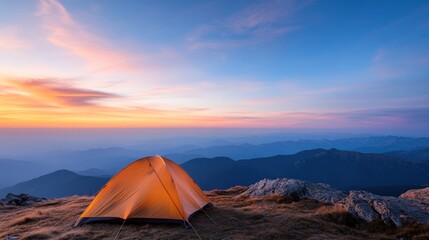 Tent set up on a cliff edge overlooks a vast wilderness at dawn, embodying the spirit of adventure and resilience