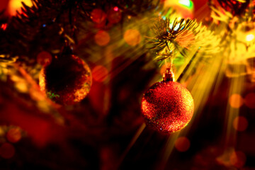 Golden ball decoration on a festive Christmas tree branch