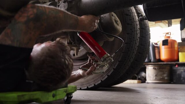 Mechanic repairing truck 7
