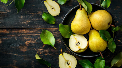 A dish with a combination of whole and sliced pears is elegantly arranged. The whole pears display their smooth, golden-yellow skin with a slight blush, while the sliced pear reveals its juicy, creamy