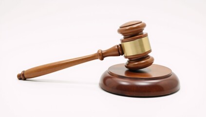 Wooden judges gavel on a plain backdrop embodies power fairness and legal principles