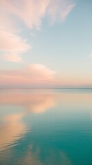 Obraz premium Peaceful Seascape with Gentle Pastel Clouds and Calm Waters
