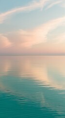 Obraz premium Dreamy Ocean Reflections Under a Blush-Tinted Sky