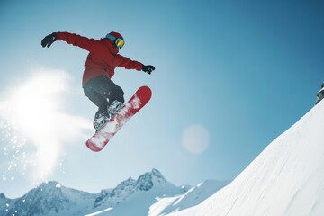 Snowboarder Leaping Against Mountain Backdrop