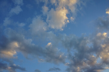 A breathtaking view of fluffy clouds drifting across a vibrant blue sky during a serene afternoon, inviting daydreams and inspiration