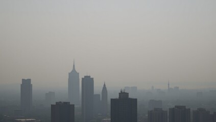 Naklejka premium Fog-shrouded urban landscape