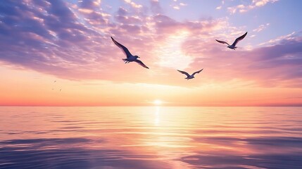 Obraz premium Silhouetted birds soaring across a vibrant sunset sky, embodying freedom and beauty over a calm ocean landscape