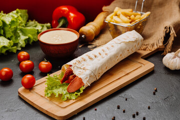 Grilled sausage wrap with fresh lettuce, a perfect quick snack or meal for on-the-go moments