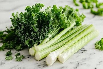 fresh green celery and kale on white marble table