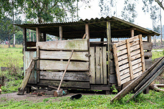 Rustic rural building in old wood for raising pigs and chickens