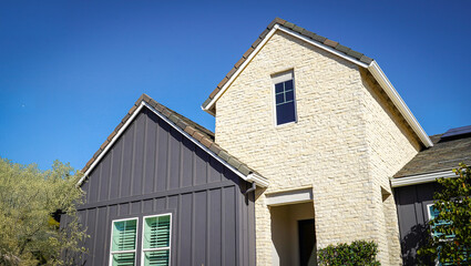 Top of a two toned house. Stone and Board and Batten
