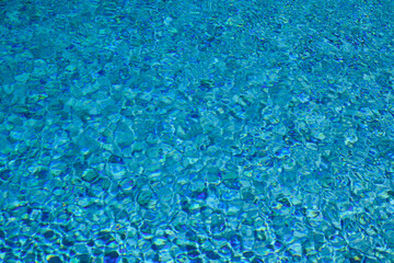 Swimming pool water with copy space. Water surface in swimming pool. Blue water background. Clear sea water texture. Sea ocean background.