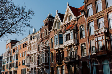 Obraz premium Tall Gingerbread Houses In Amsterdam City Street
