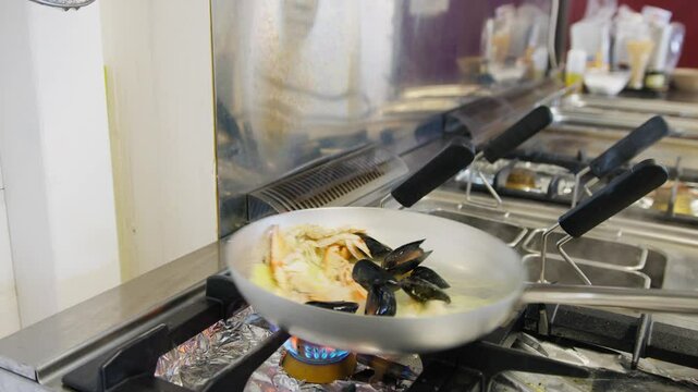 Cooking Fresh Prawns and Taranto Mussels in an Puglia Restaurant
