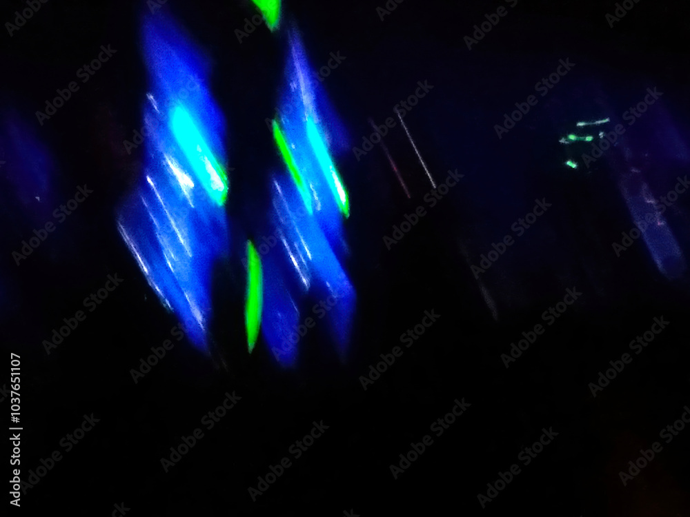 Poster abstract spots of light in a dark space environment during a nighttime display