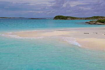 Splashing in crystal clear waters off the coast of Exuma, Bahamas