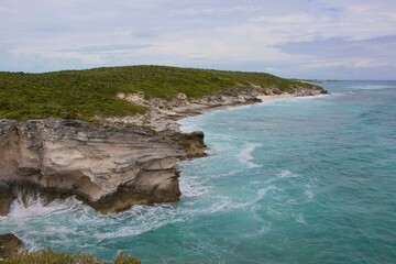 The waves of the Atlantic splash up on the coast of a cay in the Exuma chain of islands in the Bahamas