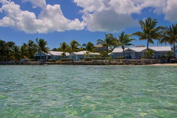 Splashing in crystal clear waters off the coast of Exuma, Bahamas