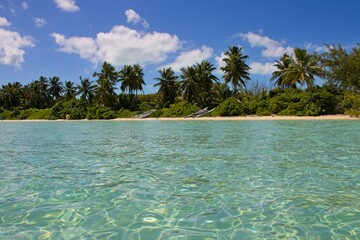 Splashing in crystal clear waters off the coast of Exuma, Bahamas