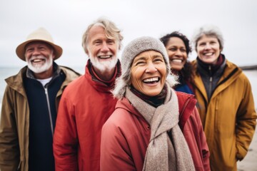 Smiling diverse group of friends on the cold beach