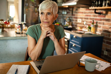 Senior woman working from home on a laptop