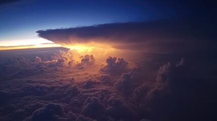Dramatic aerial view of sunlight breaking through dark hurricane clouds over the ocean at dusk - hurricane concept