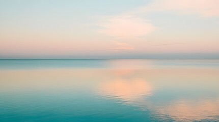 Fototapeta premium Peaceful Ocean Horizon with Soft Pastel Clouds Reflecting on Calm Water in a Tranquil Scene