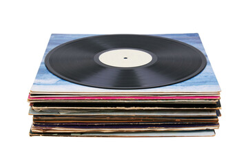 Vinyl record on a stack paper envelopes. Analog sound. Classic audio. Isolated on white